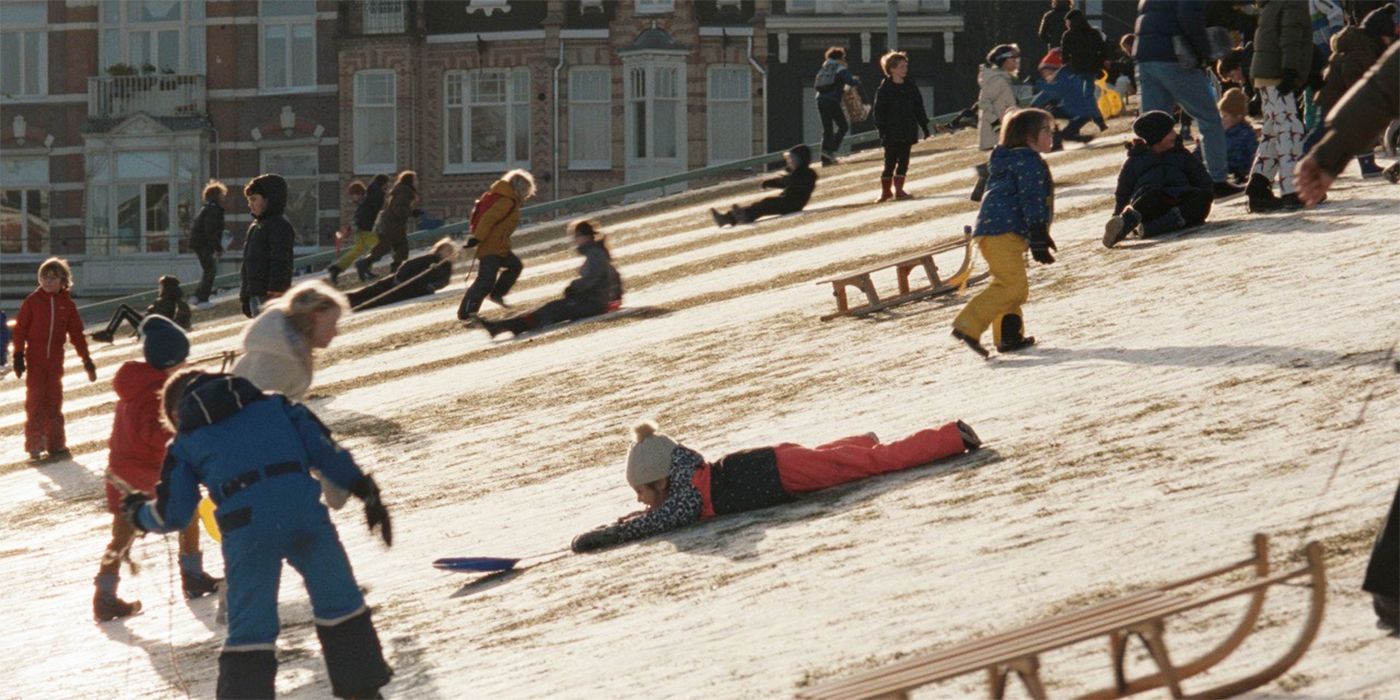 A child sledding in Amsterdam from Steve McQueen's Occupied City documentary