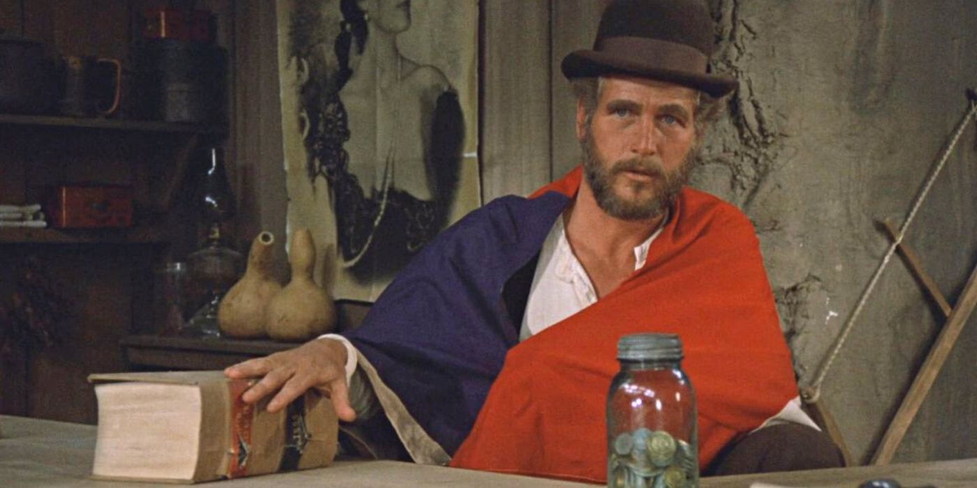 Paul Newman sitting at a bar alone in The Life and Times of Judge Roy Bean