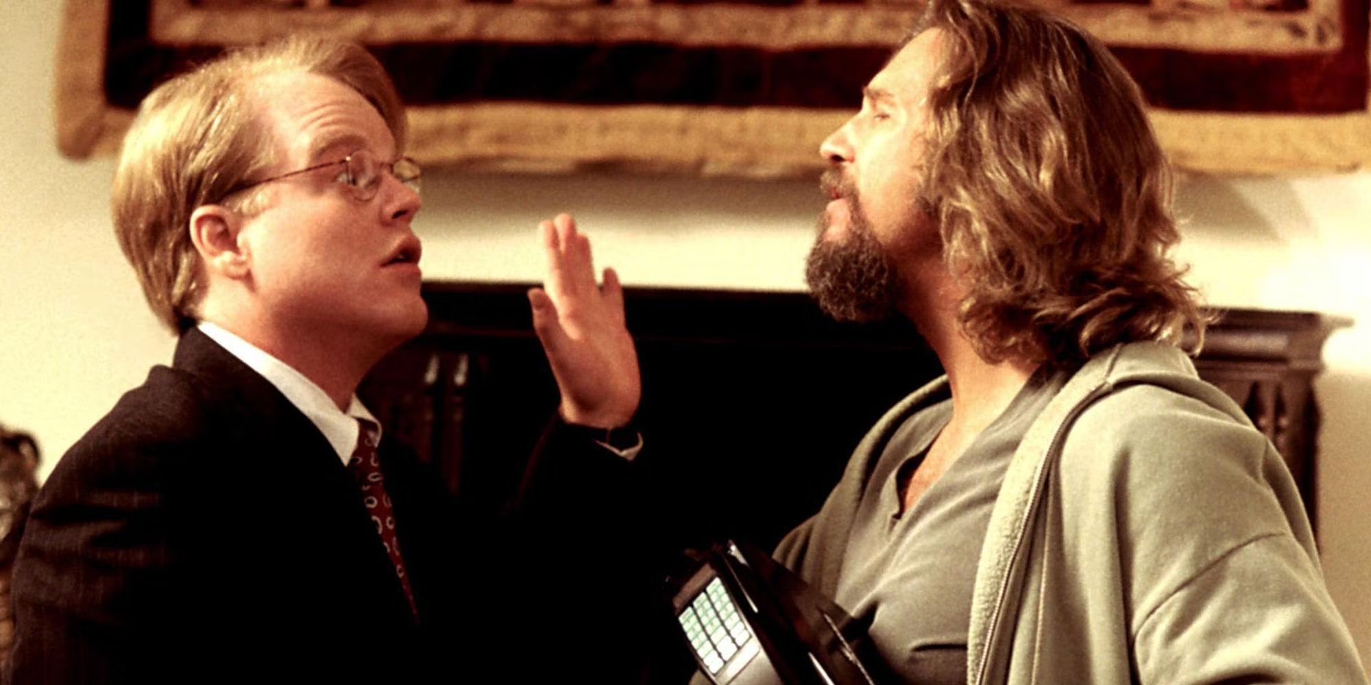 Philip Seymour Hoffman and Jeff Bridges having a discussion in 'The Big Lebowski'.