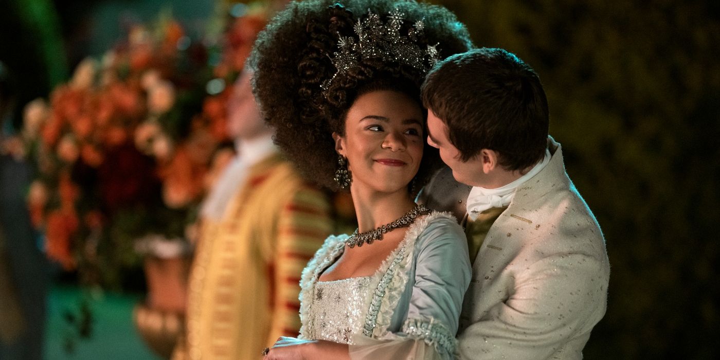 India Amarteifio as Charlotte & Corey Mylchreest as George in an embrace in Netflix's Queen Charlotte