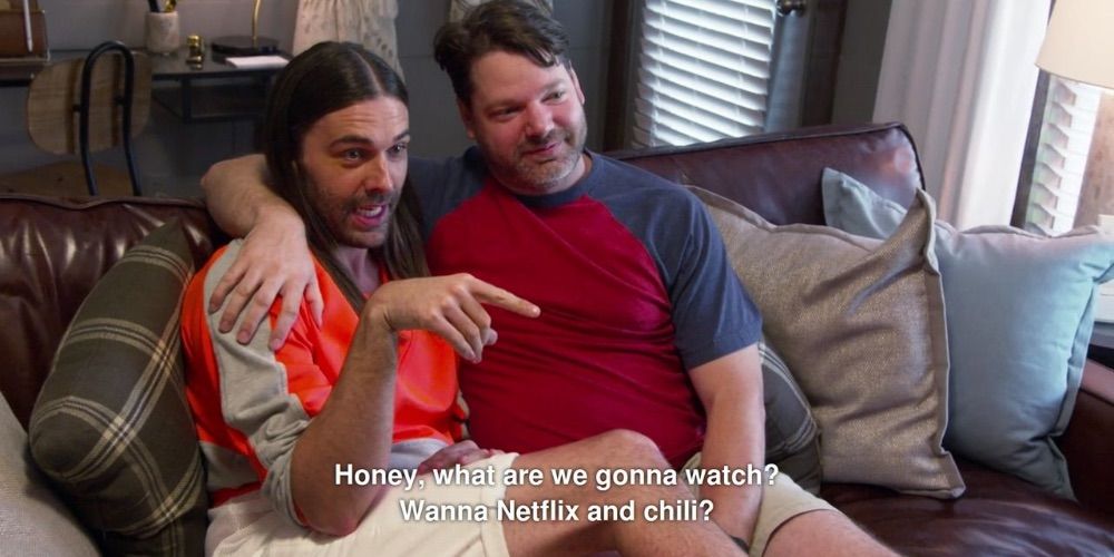Jonathan Van Ness and William Menkin sit on a couch - Queer Eye