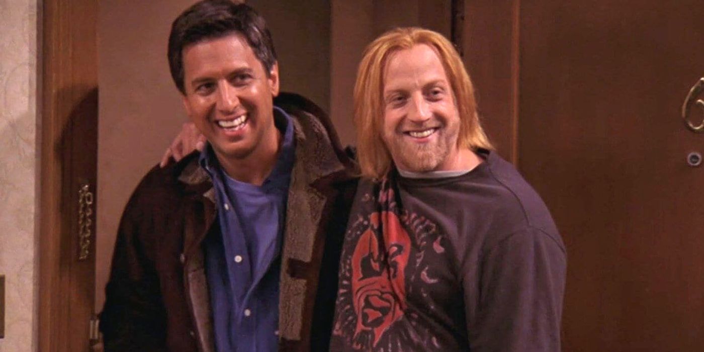 Chris Elliott smiling with arm around Ray Romano in Everybody Loves Raymond