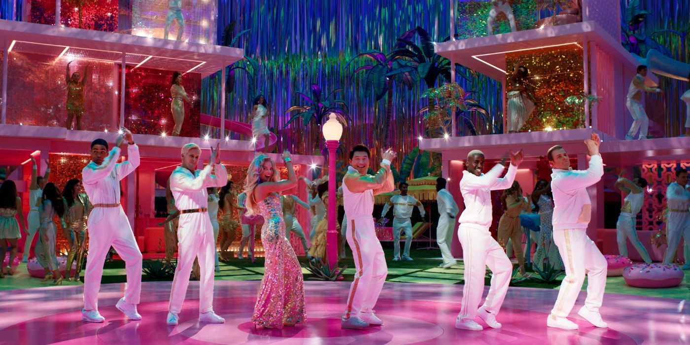 Margot Robbie as Barbie dancing alongside Kingsley Ben-Adir, Ryan Gosling, Simu Liu, Ncuti Gatwa, and Scott Evans as the Kens