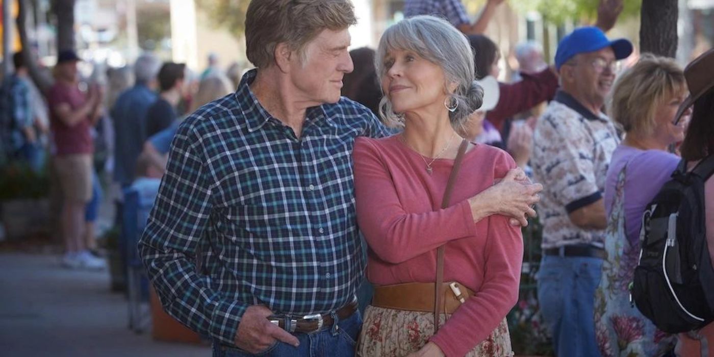 Robert Redford and Jane Fonda as Louis and Addie walking while embracing in Our Souls at Night