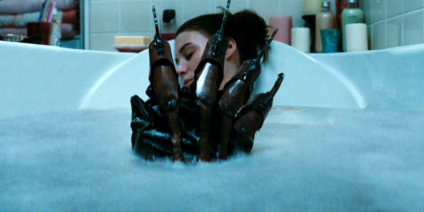Rooney Mara in a bath with Freddy's gloved hand in between her legs in A Nightmare on Elm Street 2010 Remake