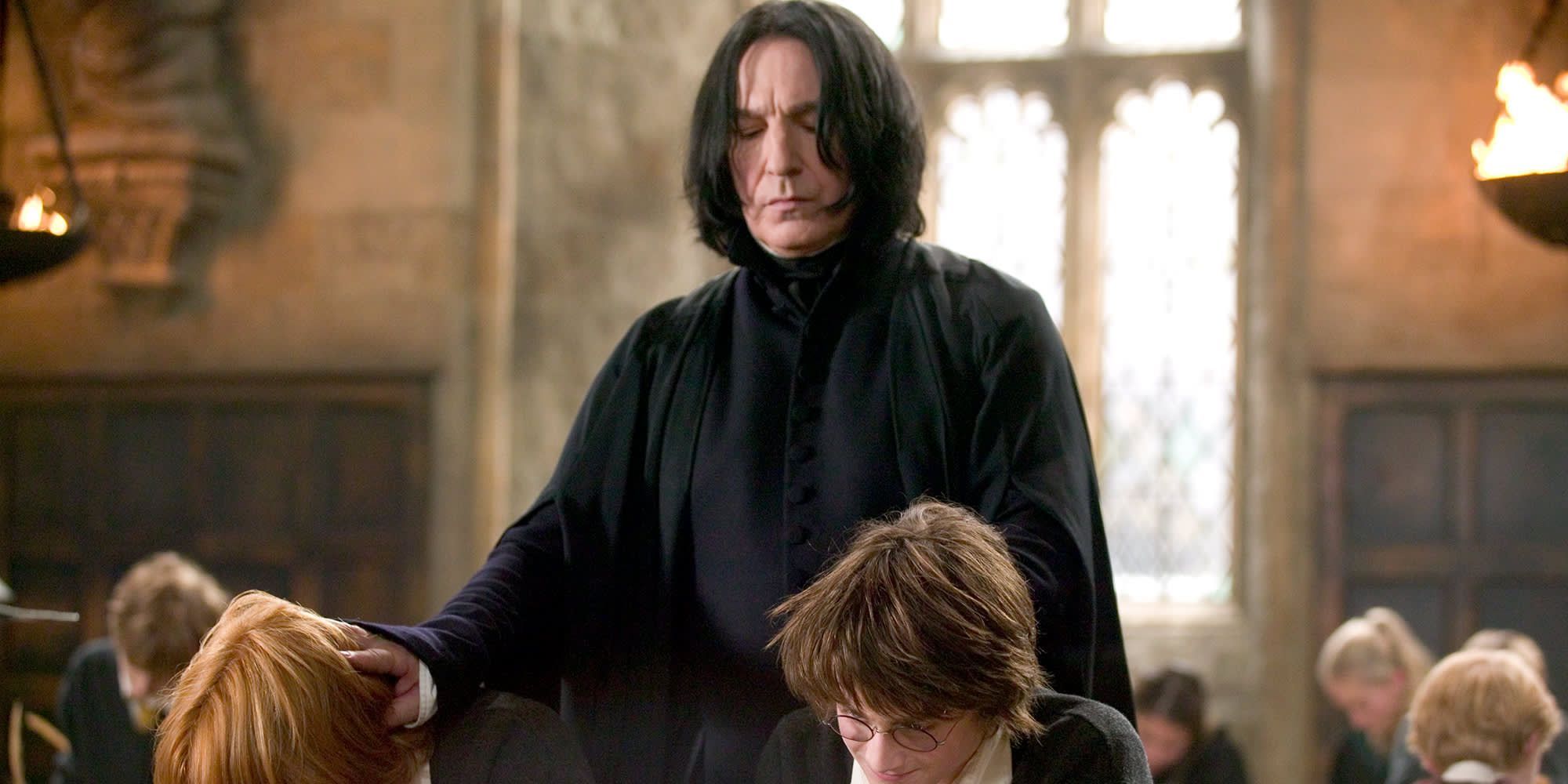 Professor Severus Snape, played by Alan Rickman, disciplines Harry and Ron