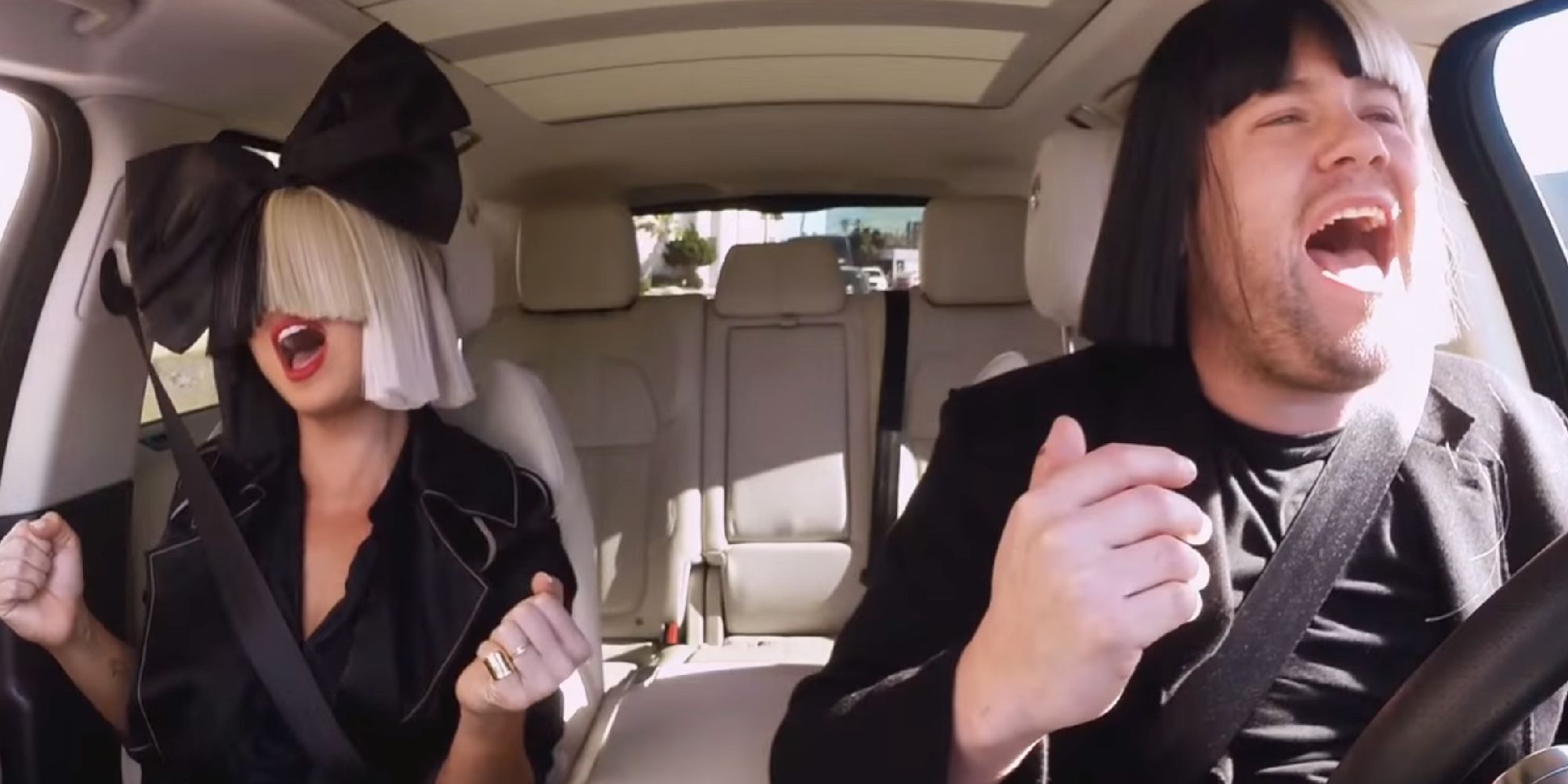 Sia and James Corden singing with wigs on