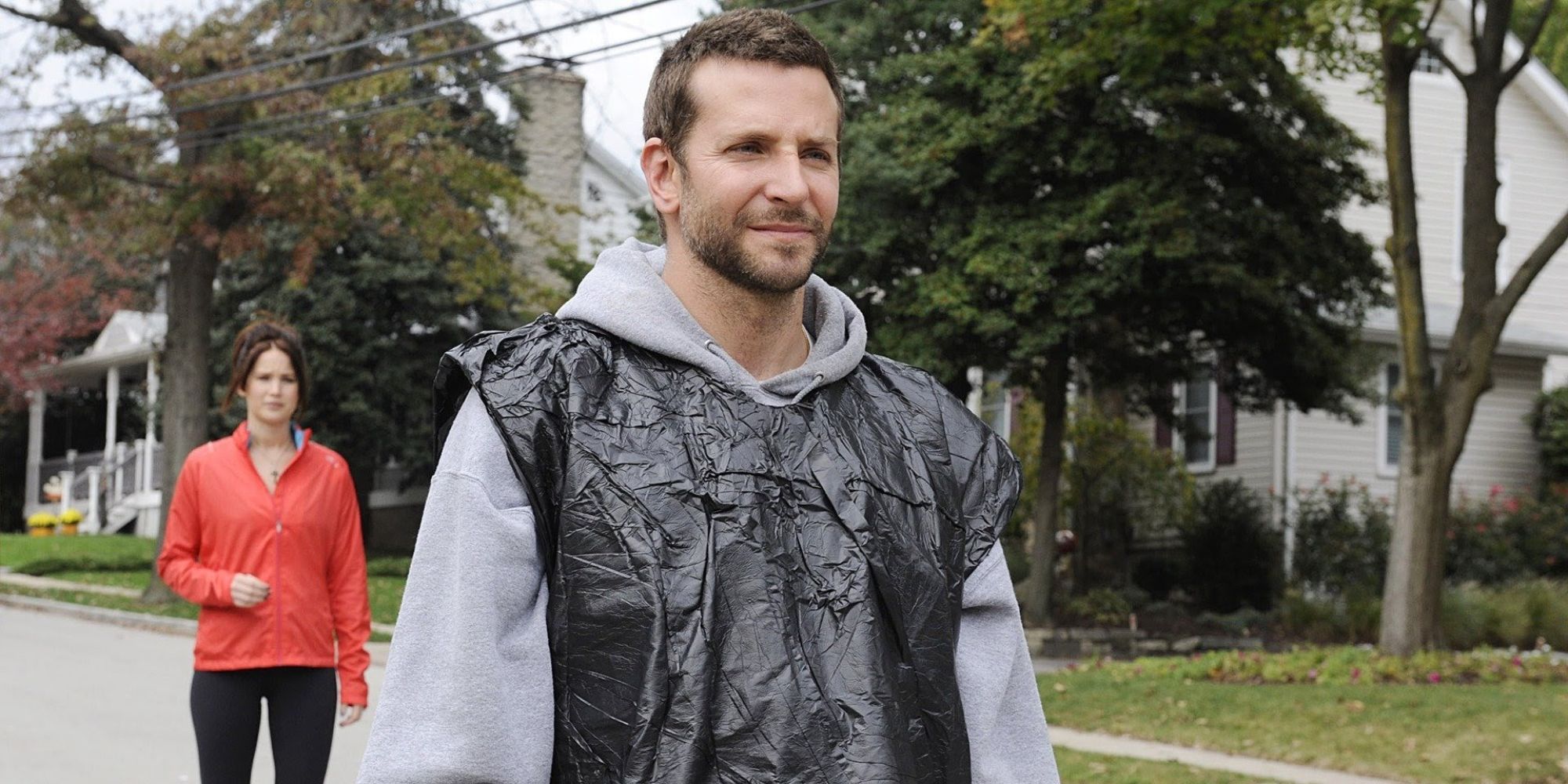 Pat Solitano (Bradley Cooper) walks down a street in Silver Linings Playbook (2012)