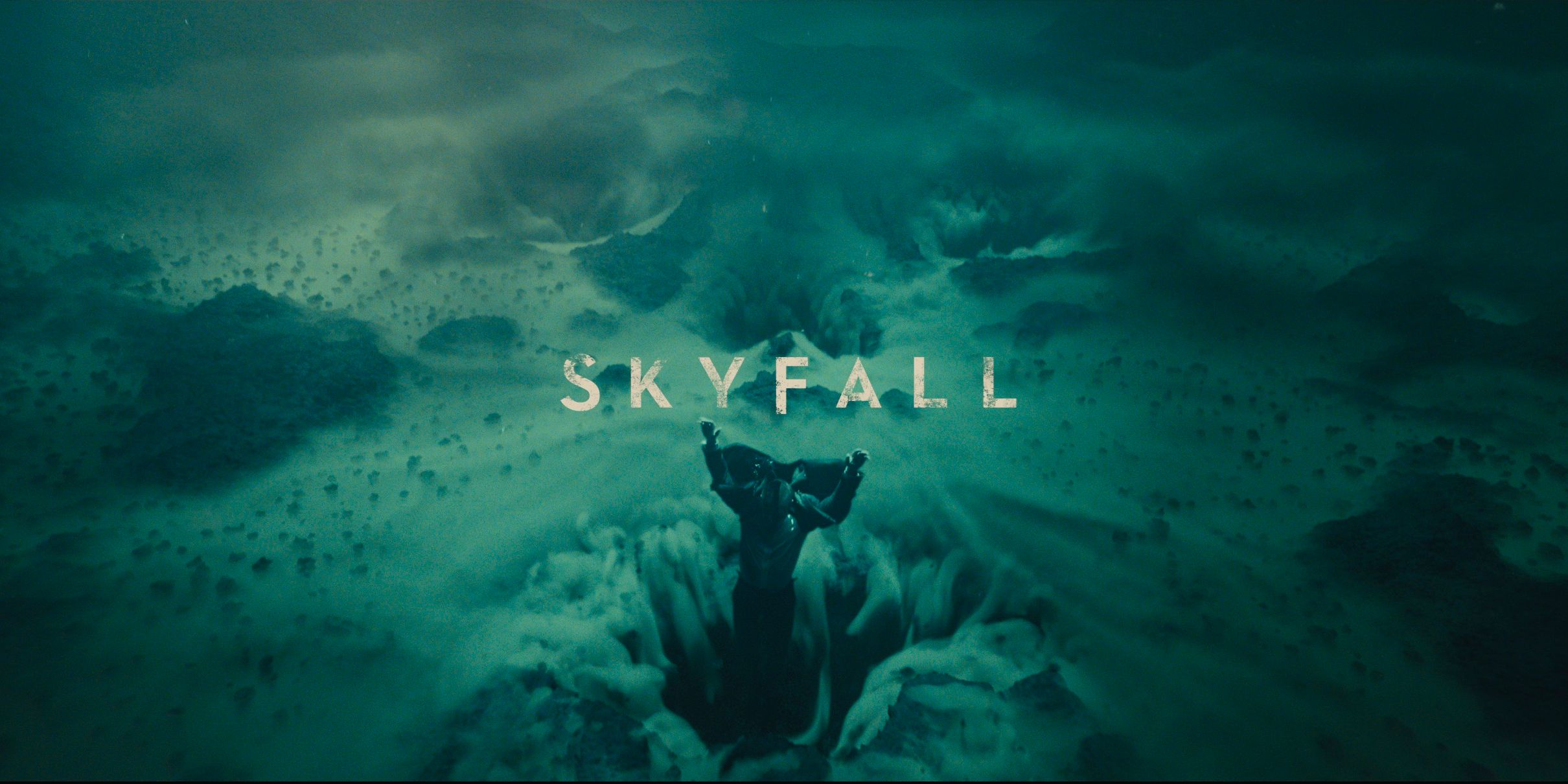 James Bond is dragged under water and into the sand in the opening credits sequence for 'Skyfall'.