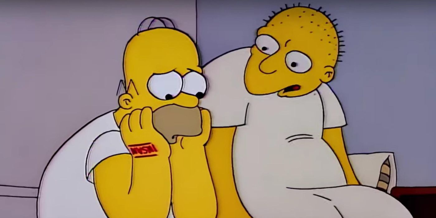 Homer frowning with his head in his hands while Michael, voiced by Michael Jackson, sits beside him in The Simpsons Season 3 