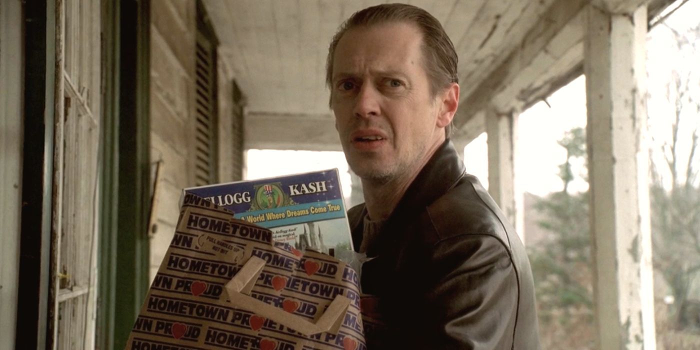 Steve Buscemi holding a bag of groceries looking to his left in The Sopranos