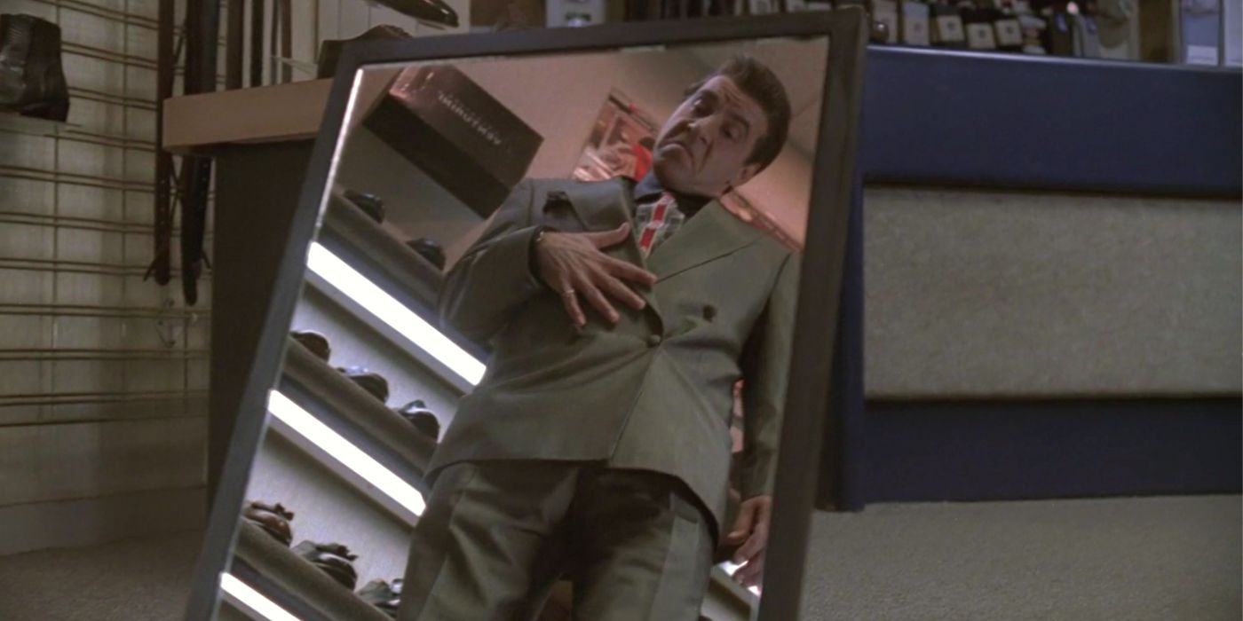 Steven Van Zandt as Silvio Dante looking at himself in the mirror in The Sopranos