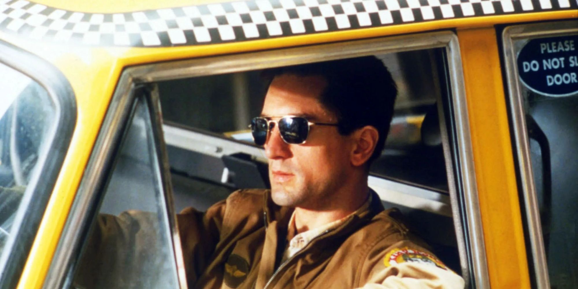 Travis Bickle driving a taxi in Taxi Driver