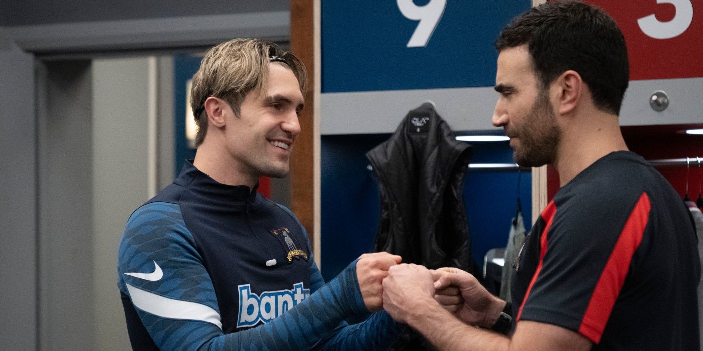 Brett Goldstein as Roy and Phil Dunster as Jamie fist bumping in the Ted Lasso Season 3 finale
