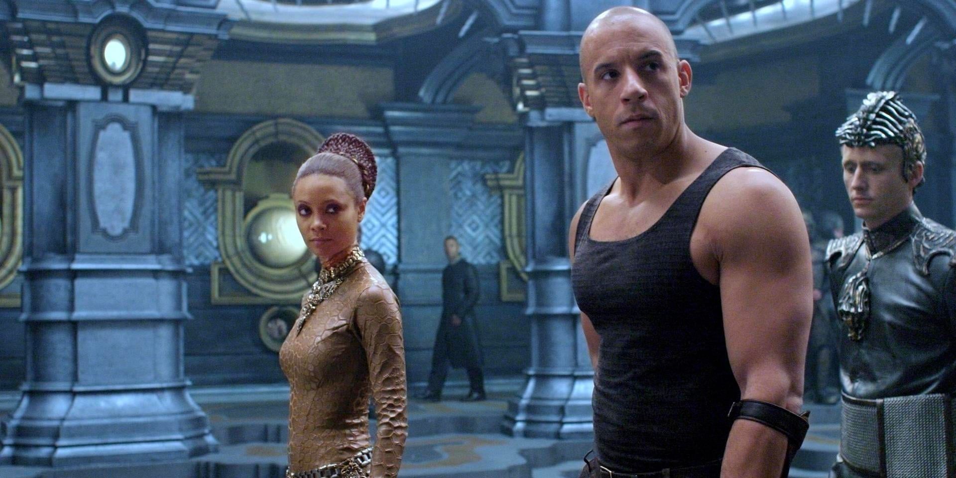 Riddick stands in the halls of a sci-fi vessel in 'The Chronicles of Riddick'.