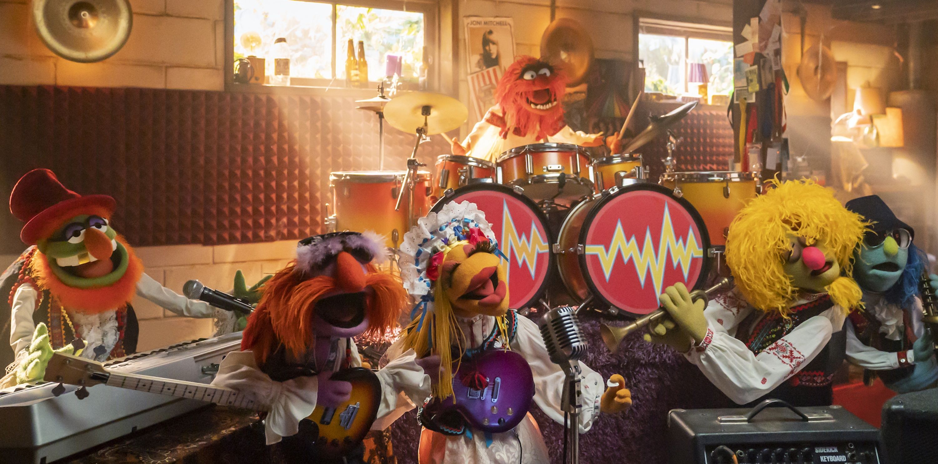 The Electric Mayhem, featuring Dr. Teeth, Floyd Pepper, Janice, Animal, Lips and Zoot, in The Muppets Mayhem