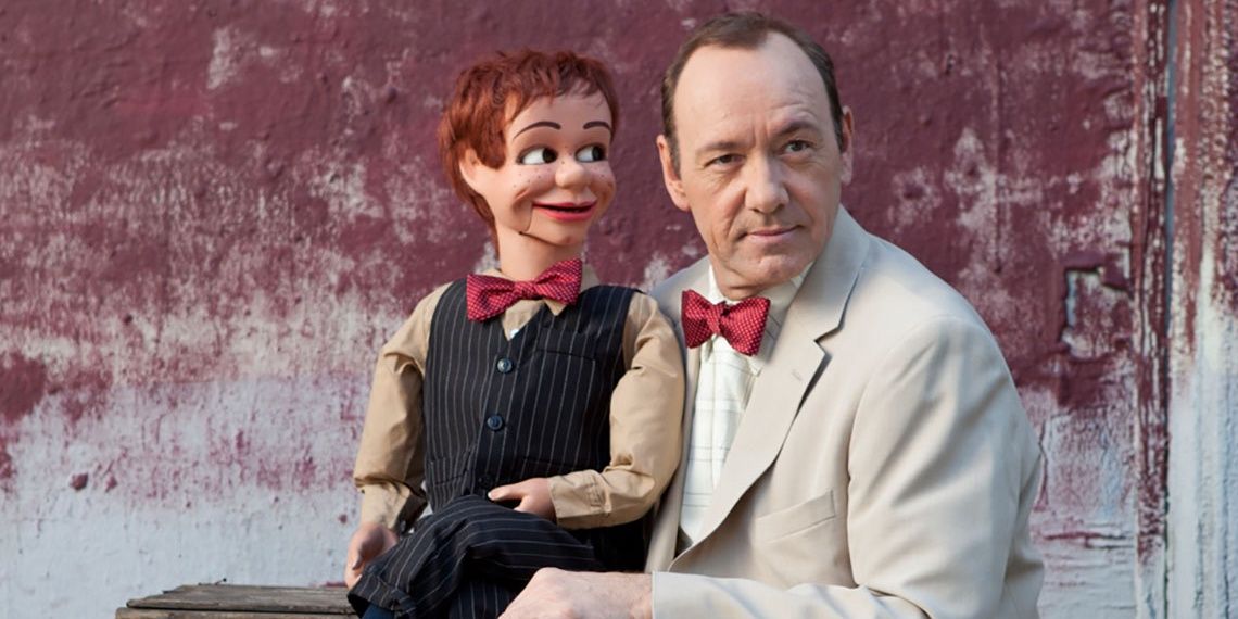 Bryan Cranston sat with a puppet