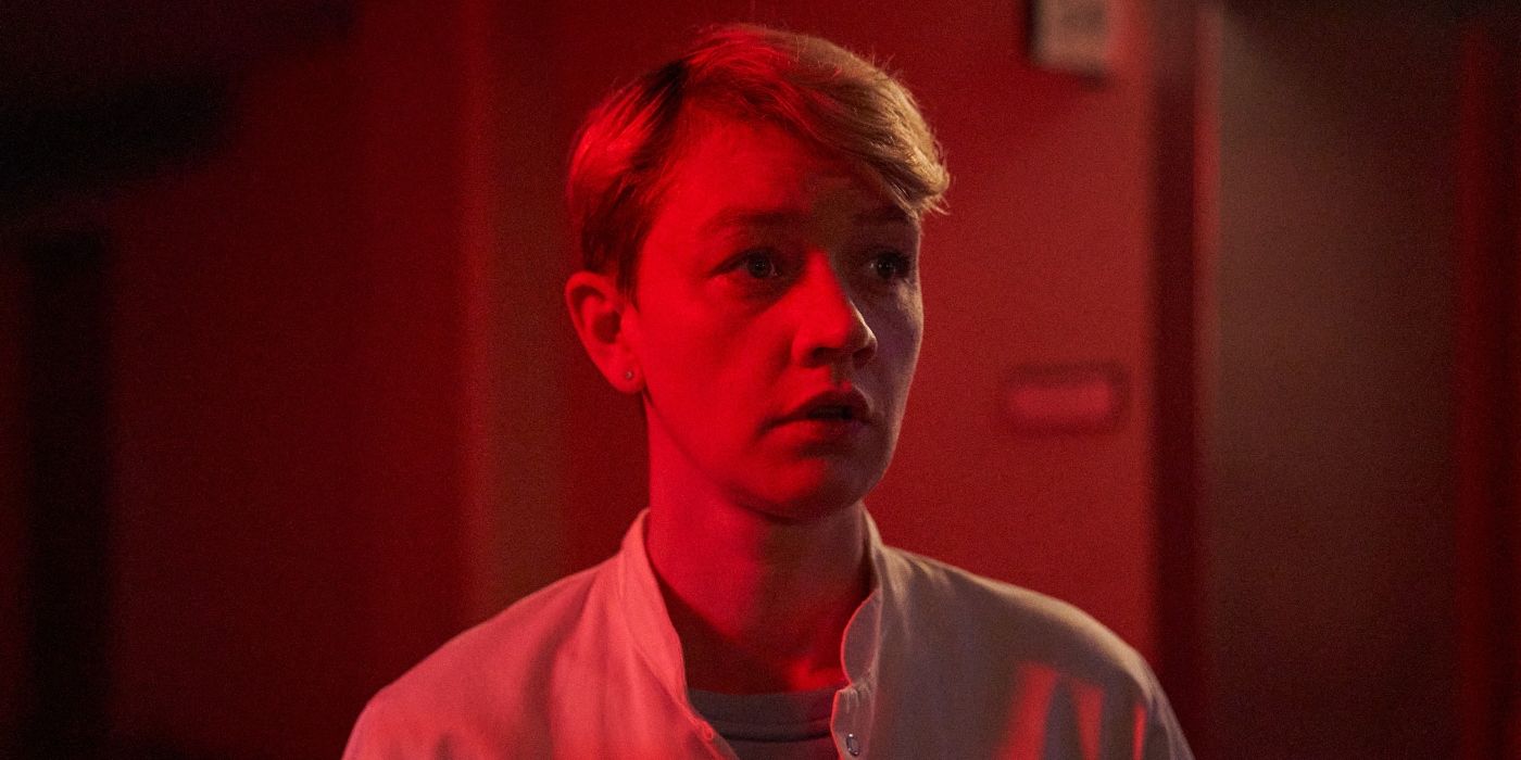 close up of Fanny Louise Bernth as Pernille Kurzmann in red lighting The Nurse. 