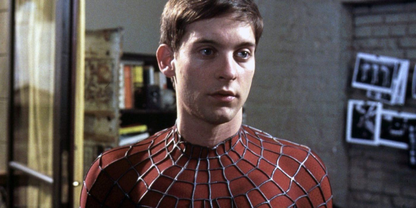 Tobey Maguire as Spider-Man with his mask off looking intently off-camera in Spider-Man (2002)