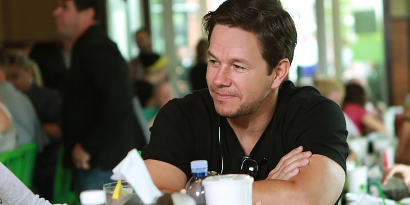 Mark Wahlberg sitting in his restaurant in a scene from Wahlburgers.