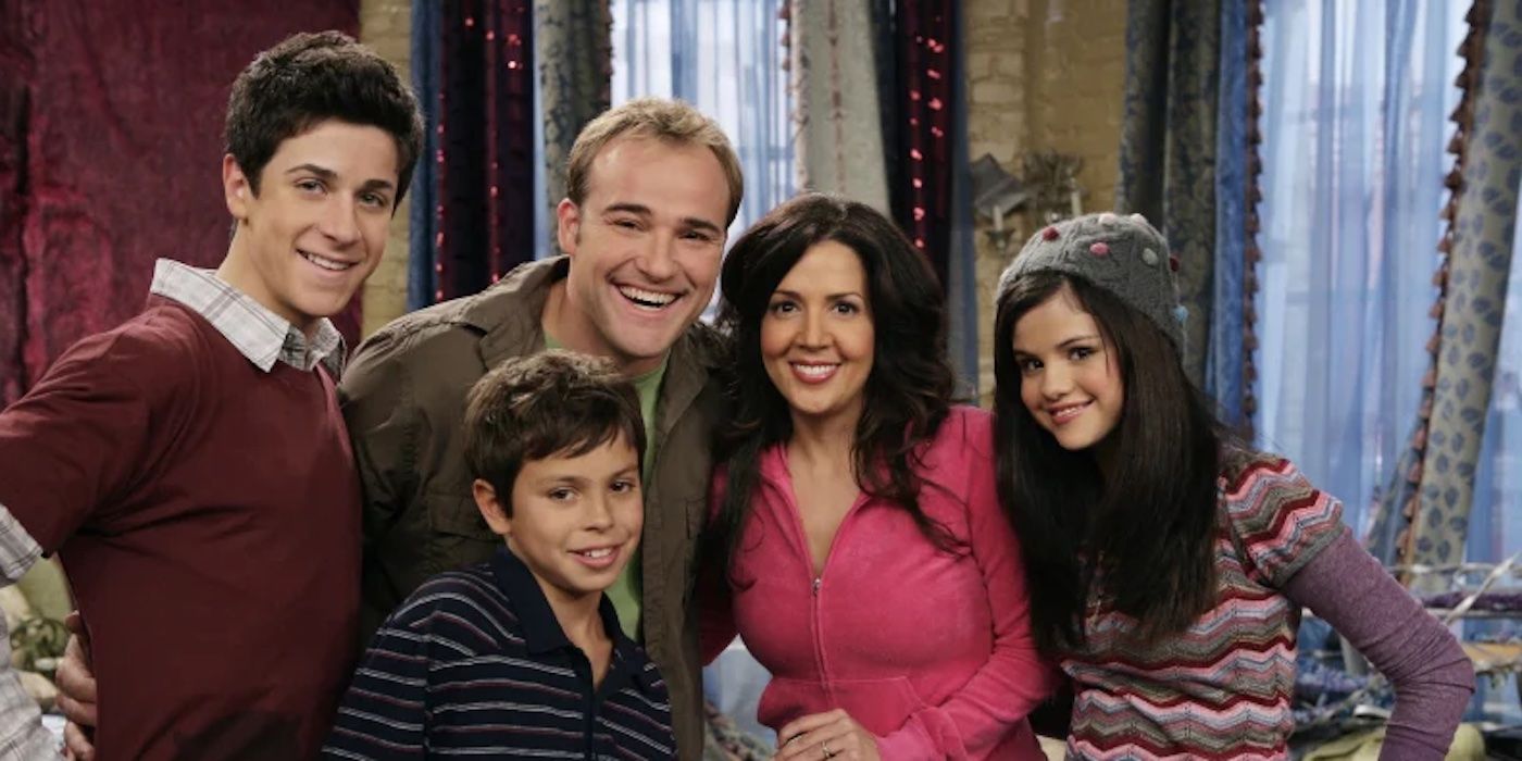 The Russo family from The Wizards of Waverly Place standing together and smiling in a promotional photo