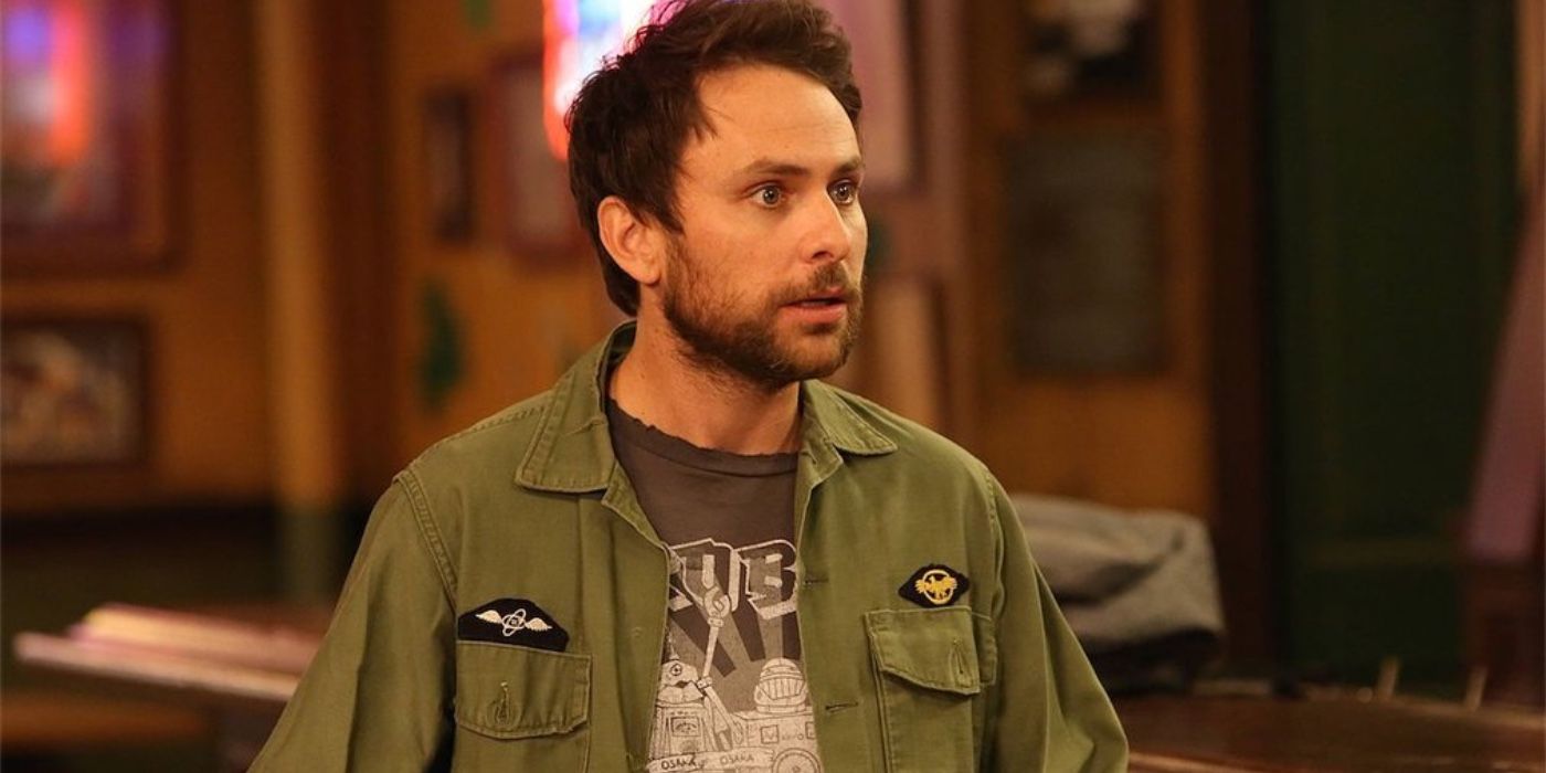 Still from 'It's Always Sunny in Philadelphia': Charlie stands centre frame looking concerned.
