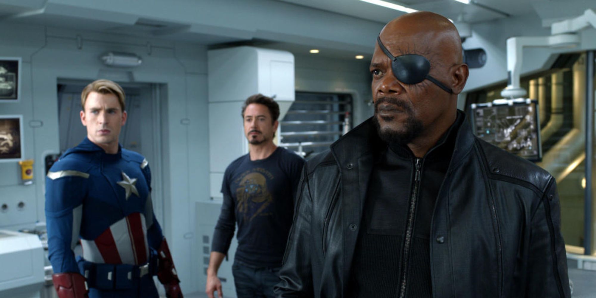 Steve Rogers, Tony Stark, and Nick Fury looking ahead in Avengers (2012)