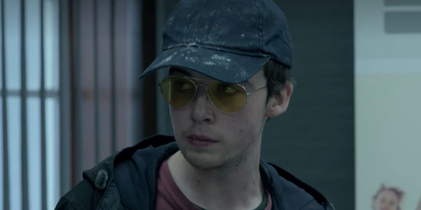 Kenny from Black Mirror's Shut Up and Dance episode looking suspicious with a hat on.