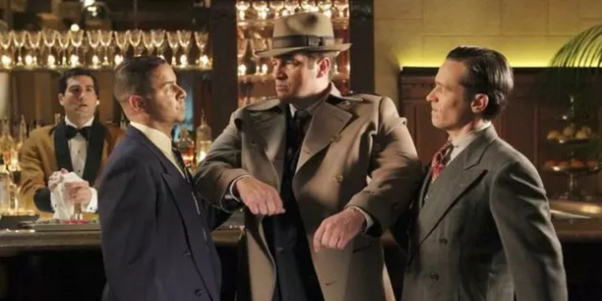 Castle as PI Joe Flynn gives a stern look to two mob henchmen