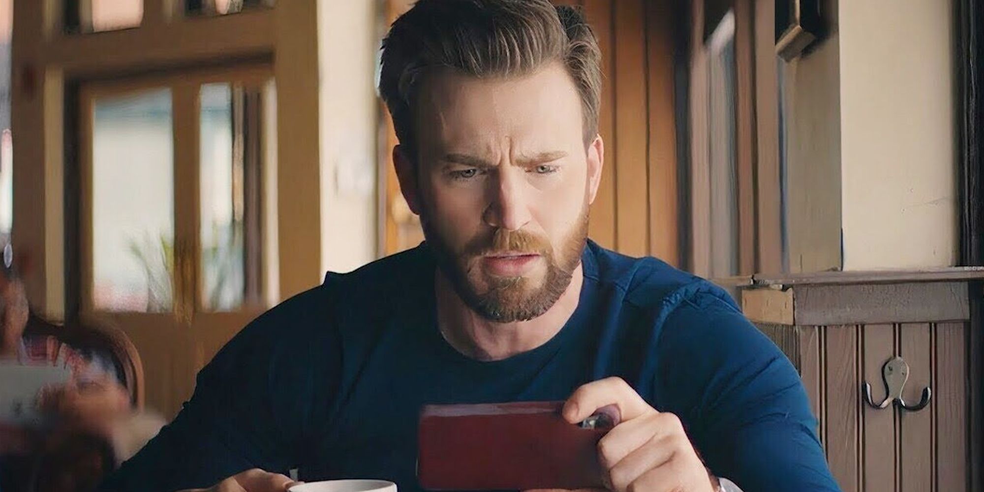 Chris Evans as himself, looking confusedly at a cellphone in Free Guy