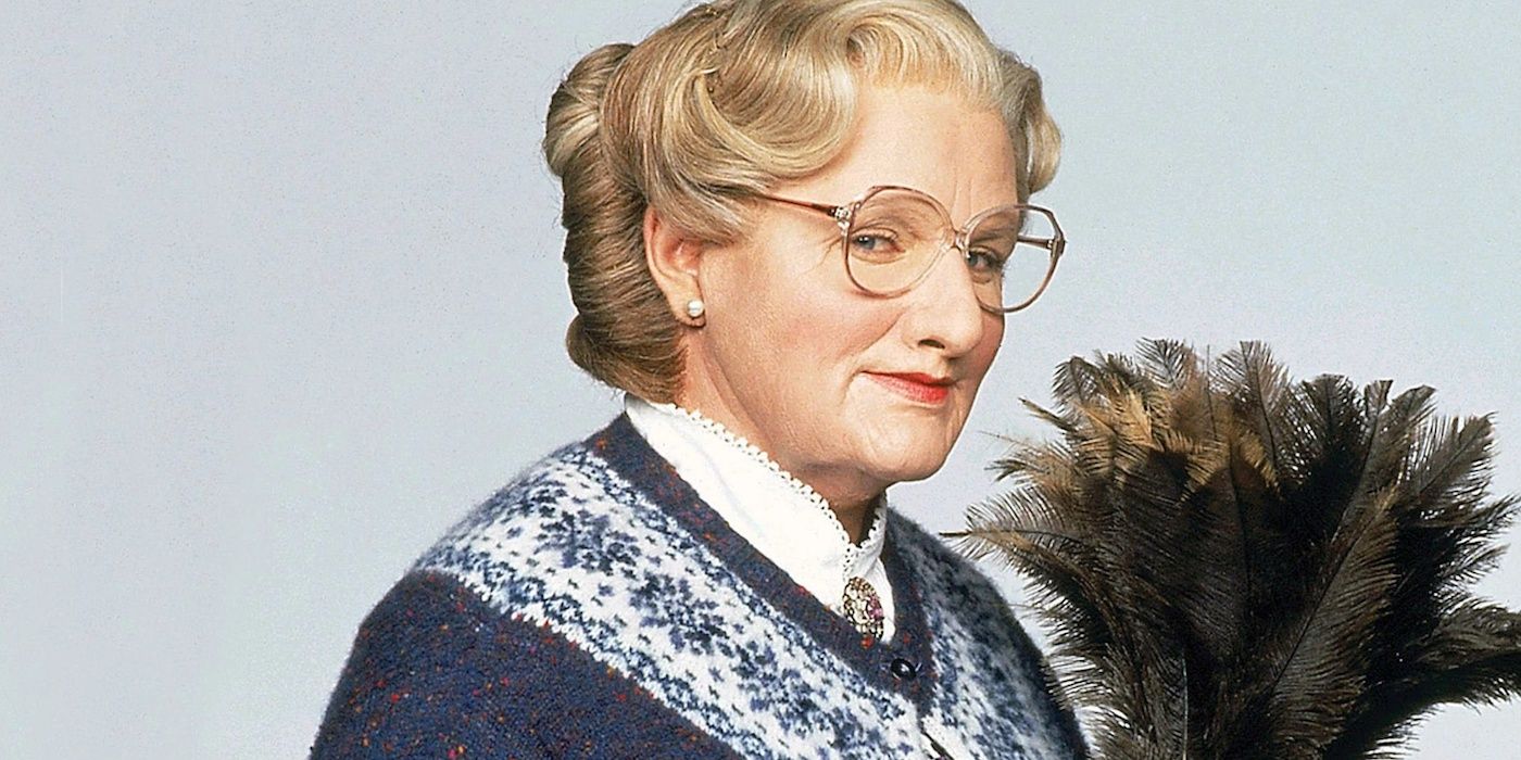 Mrs. Doubtfire (Robin Williams) holding a feather duster in 'Mrs. Doubtfire'