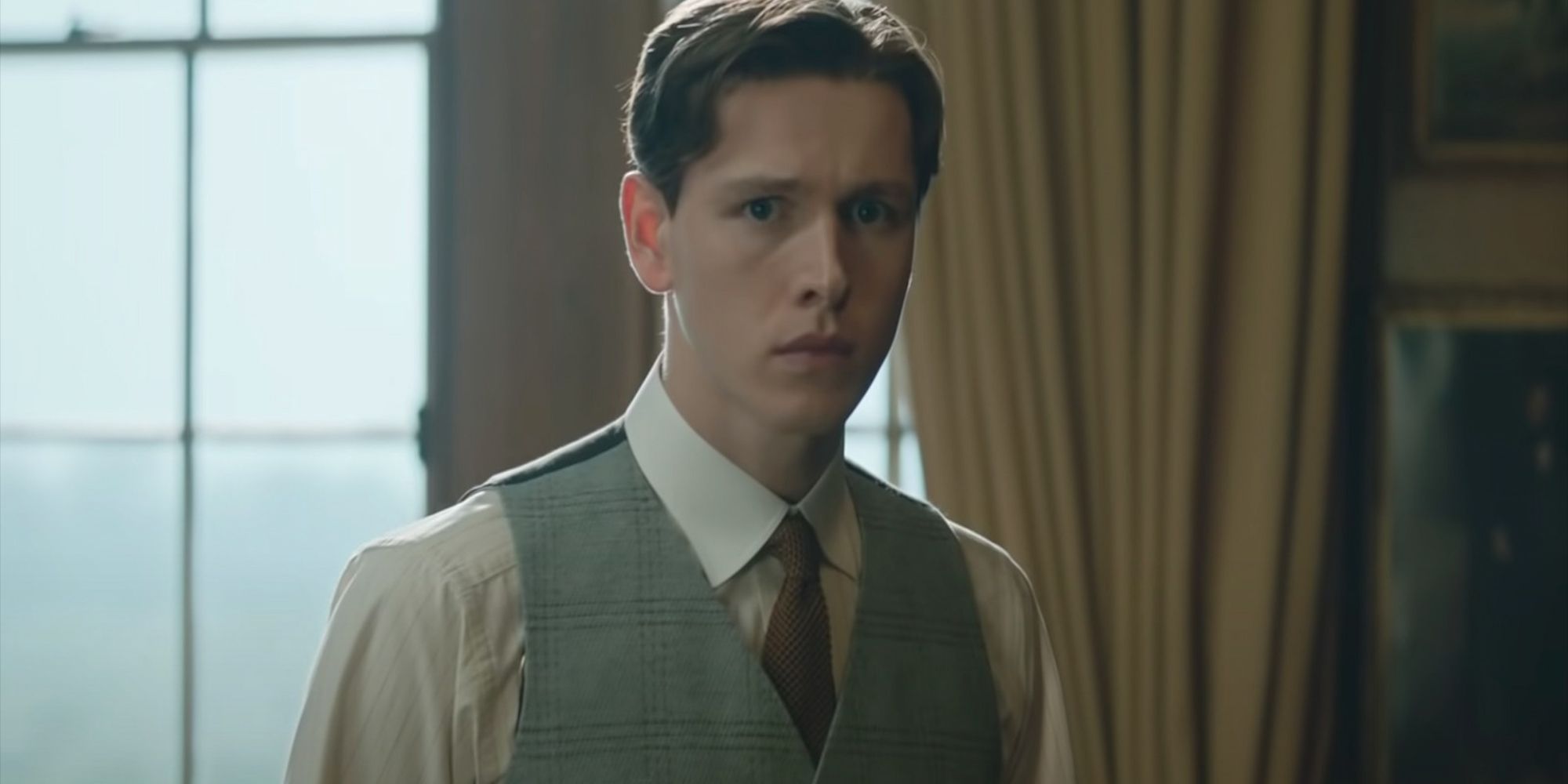 Harris Dickinson as Conrad looking concerned in The King's Man