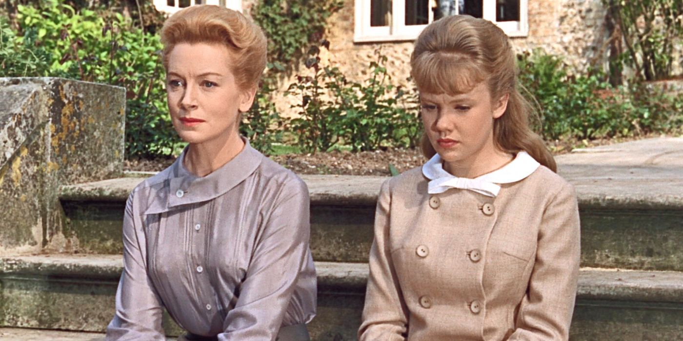 Deborah Kerr and Hayley Mills sitting side by side on the front steps outside The Chalk Garden (1964)
