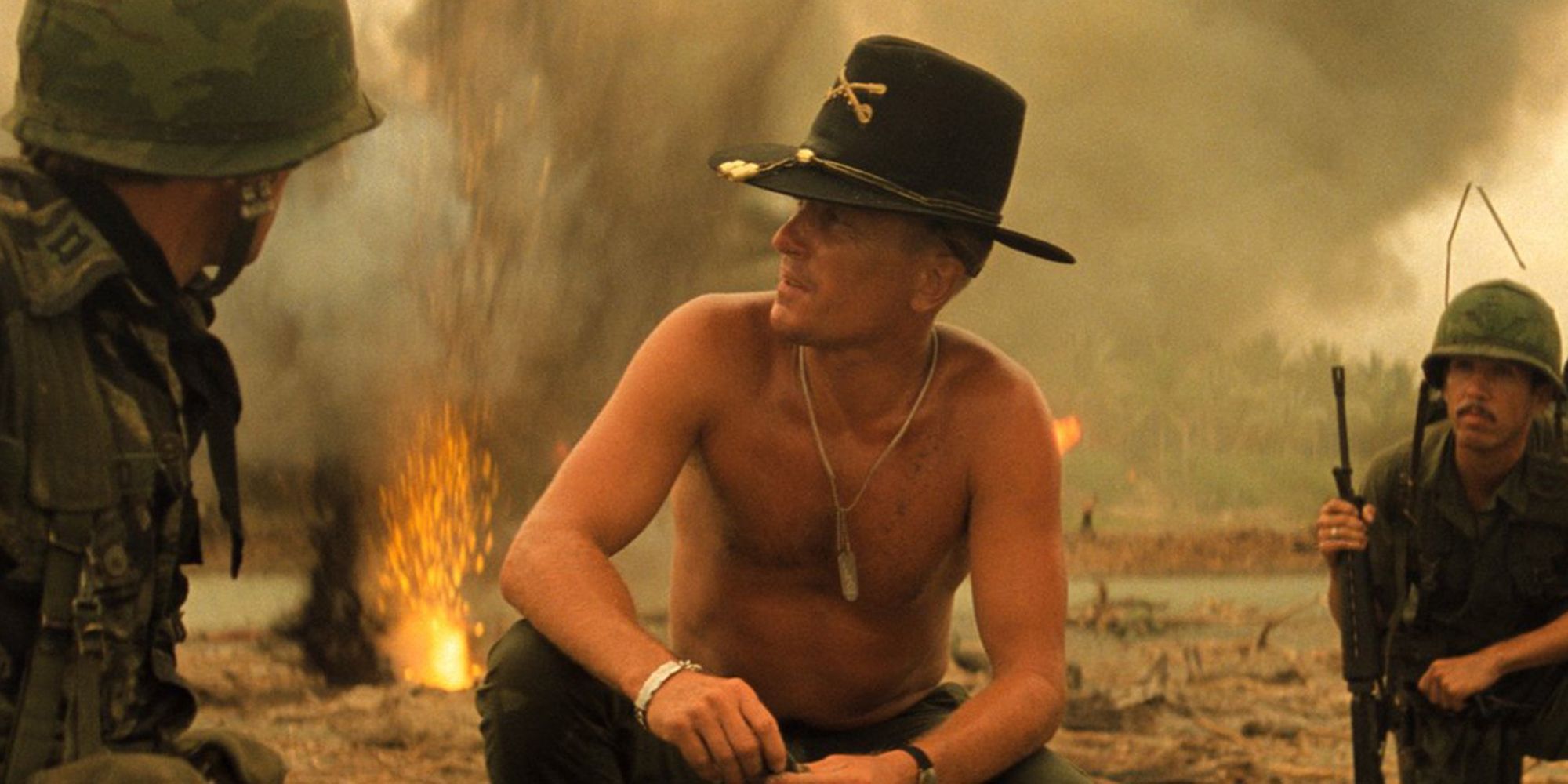 Robert Duvall as Lt. Col. Bill Kilgore kneeling shirtless in Apocalypse Now