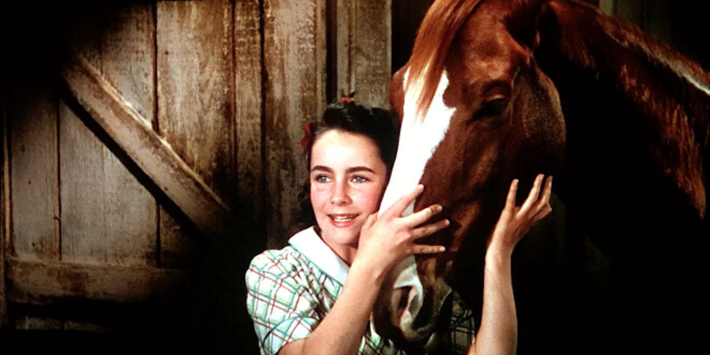 Elizabeth Taylor petting a horse in National Velvet