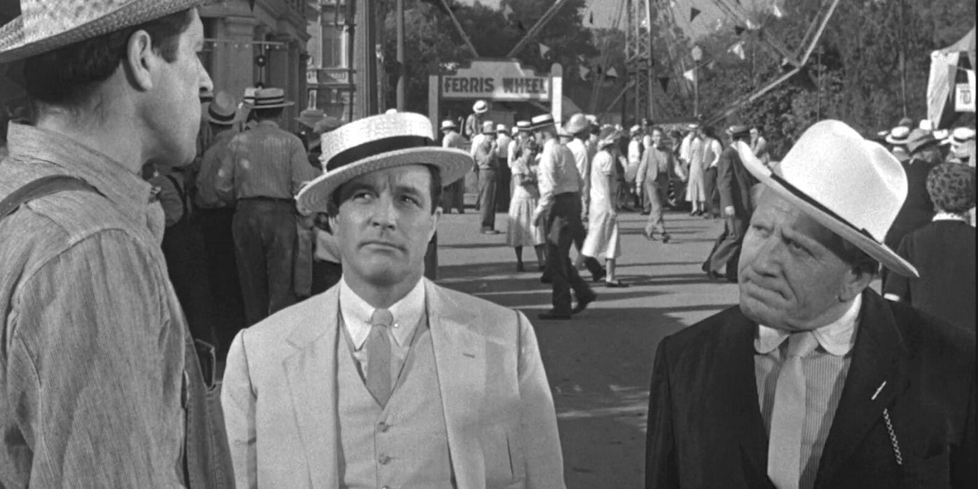 Gene Kelly and Spencer Tracy stand side by side looking at a man in Inheritance (1960)
