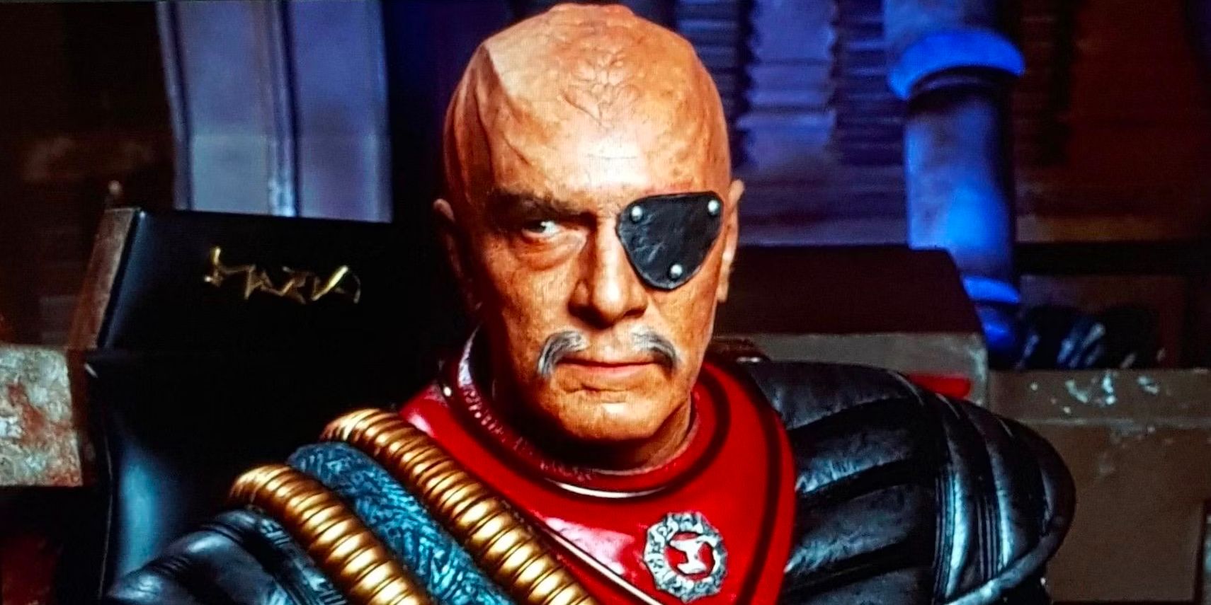 General Chang (Christopher Plummer), a blindfolded Klingon warrior, sits at the helm of his ship.