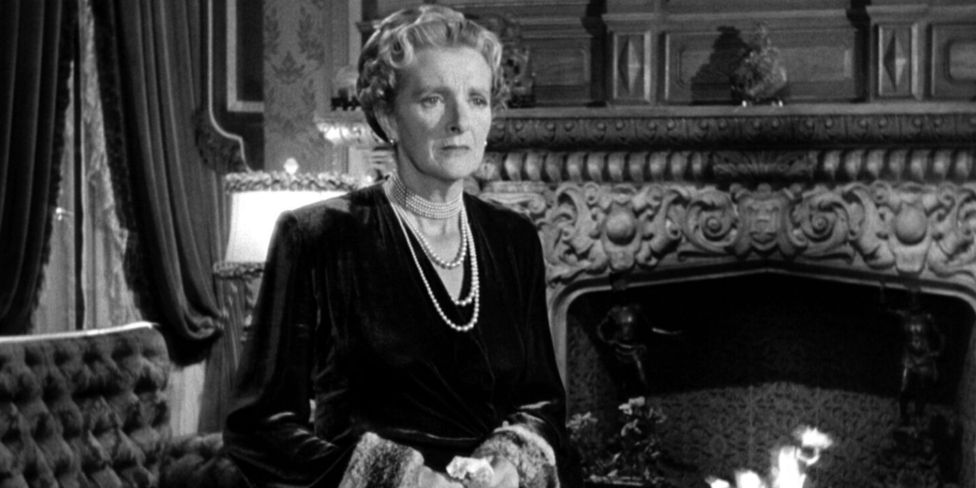 Gladys Cooper standing in the living by the fireplace in The Bishop's Wife (1947)