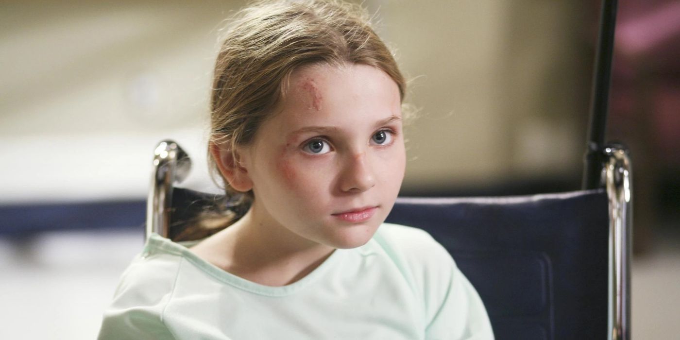 A young girl sits in a wheelchair and has small cuts on her face in Grey's Anatomy.