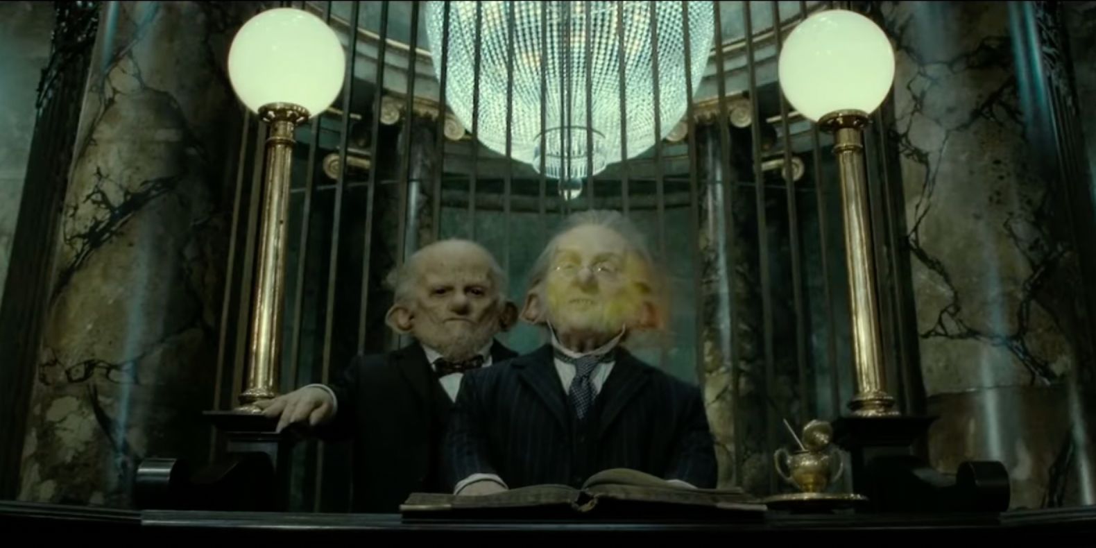 The green mist of the Imperius Curse engulfs Bogrod in Gringotts. 
