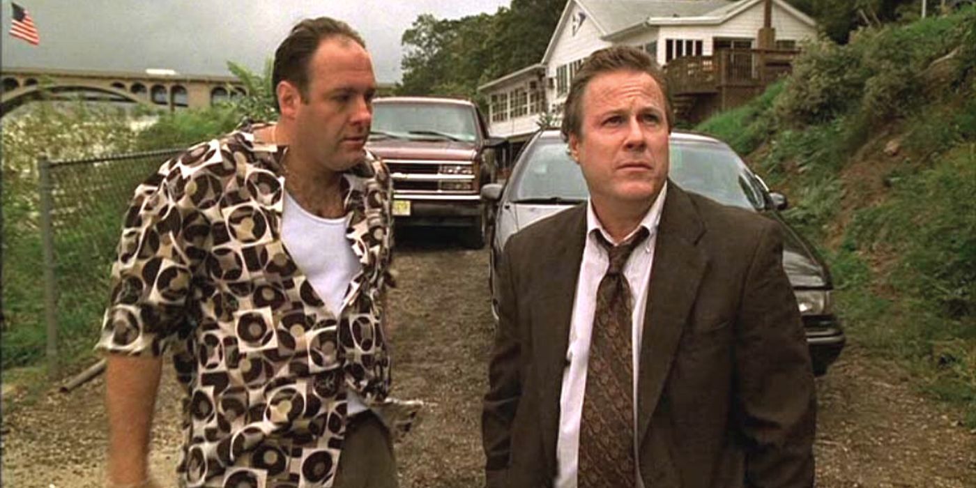 James Gandolfini looking at John Heard while standing out of their cars in The Sopranos