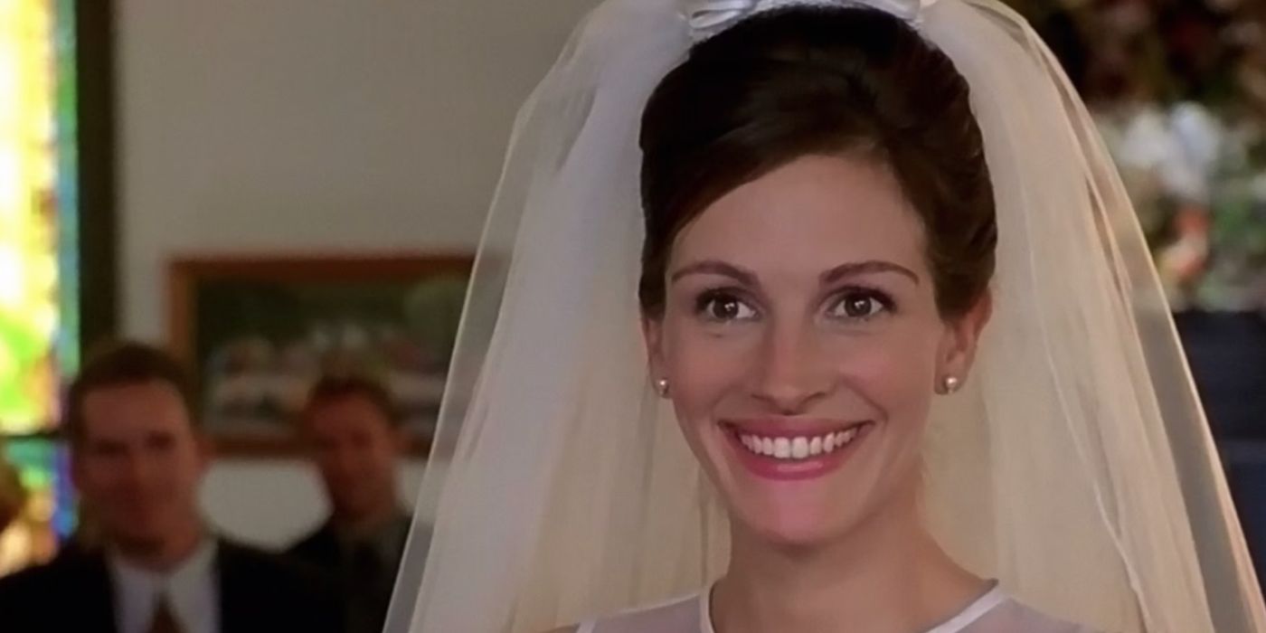 Maggie Carpenter smiling in a wedding dress in Runaway Bride