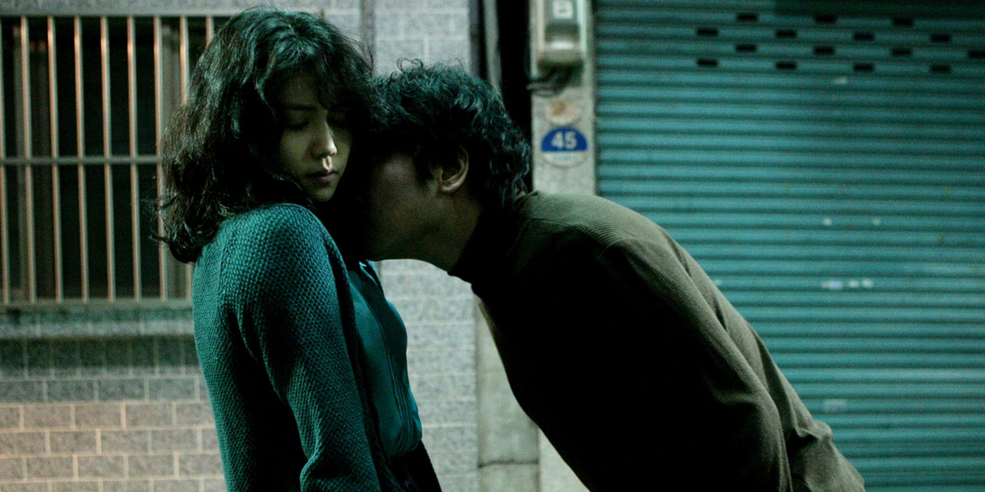 Kim Ok-bin and Song Kang-ho in Thirst. He is kissing her neck.