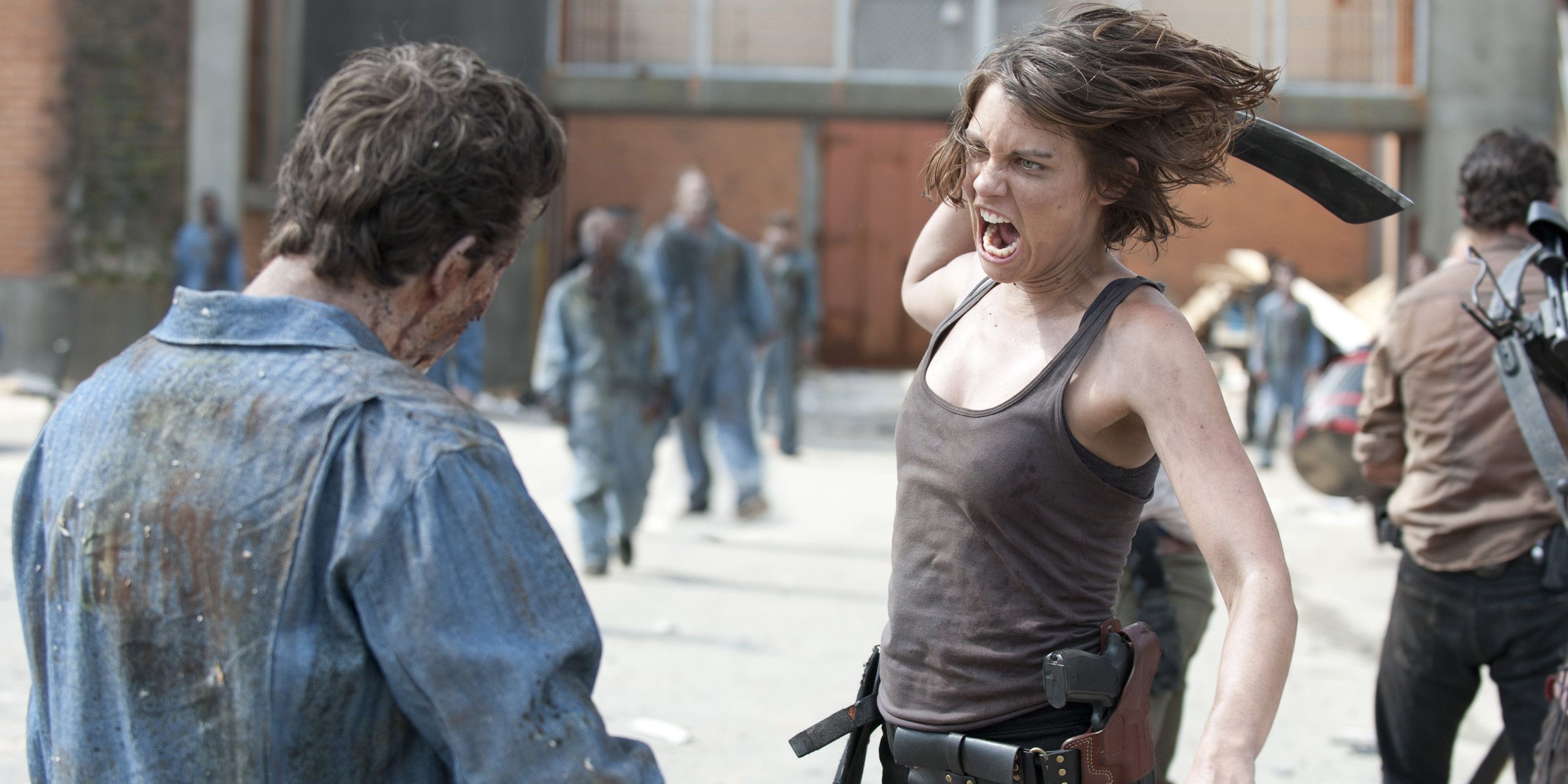 Lauren Cohan as Maggie on The Walking Dead winding up to slash a walker