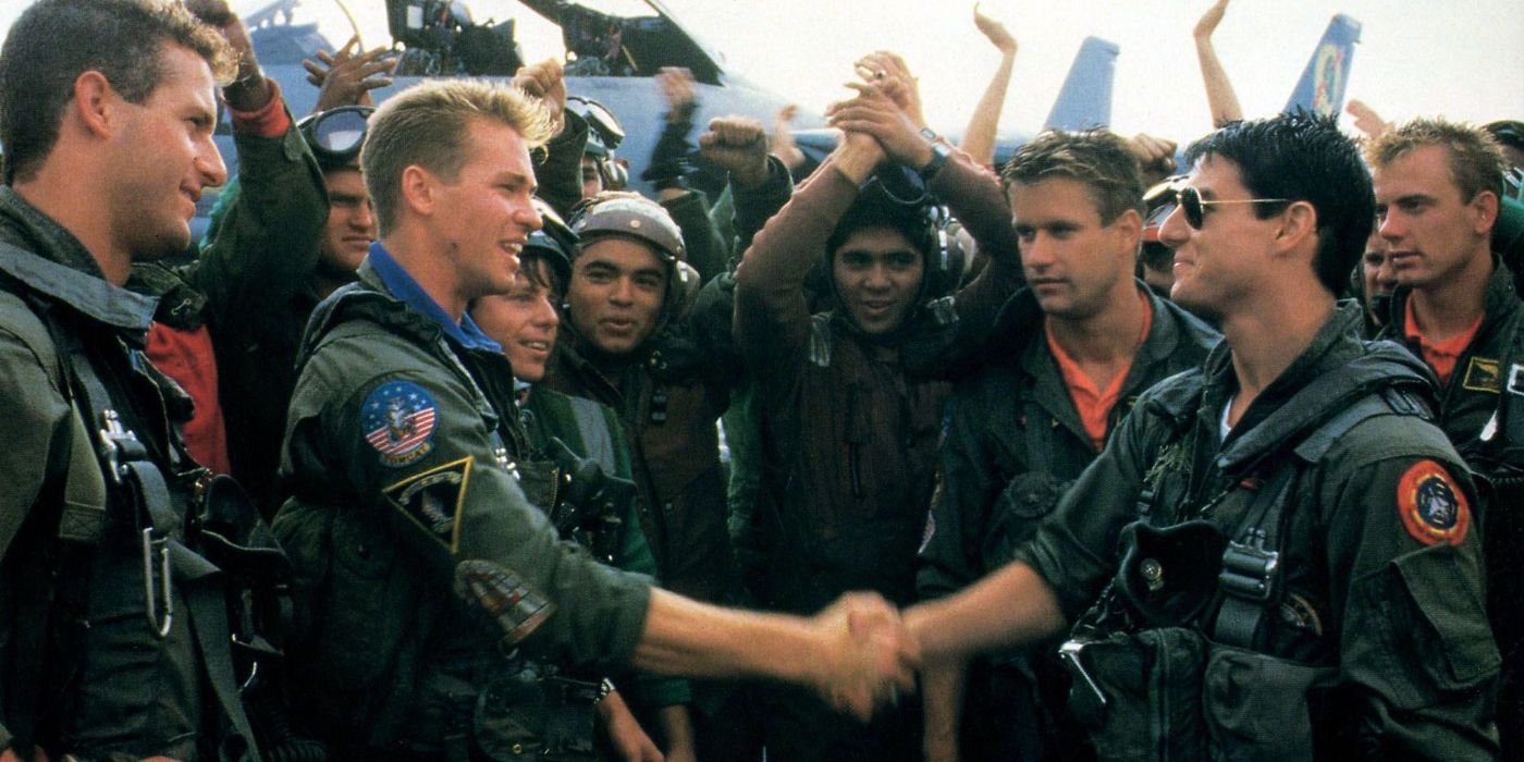 Val Kilmer shakes hands with Tom Cruise as Maverick as Iceman in 'Top Gun'