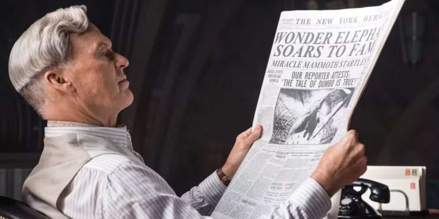 Michael Keaton as V. A. Veldevere reading a newspaper in Dumbo