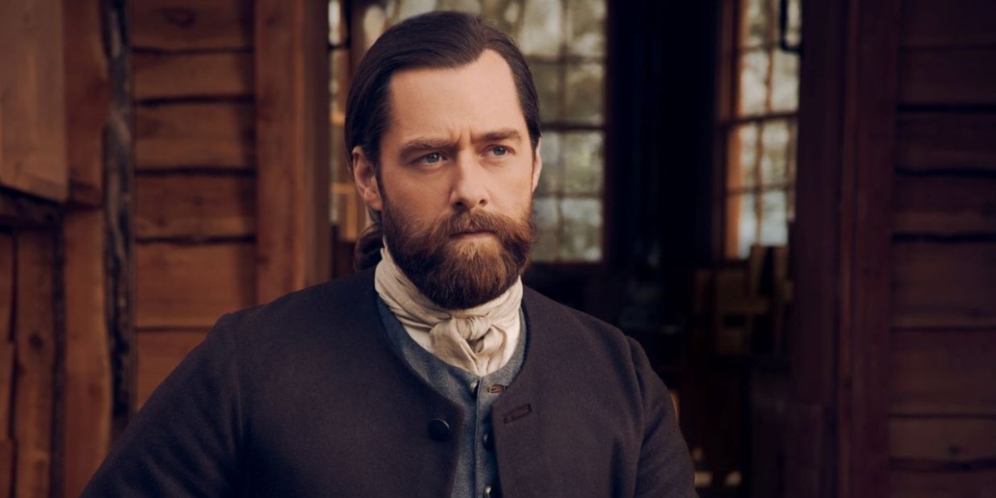 Roger Wakefield, played by Richard Rankin, wearing a dark outfit in 'Outlander.'