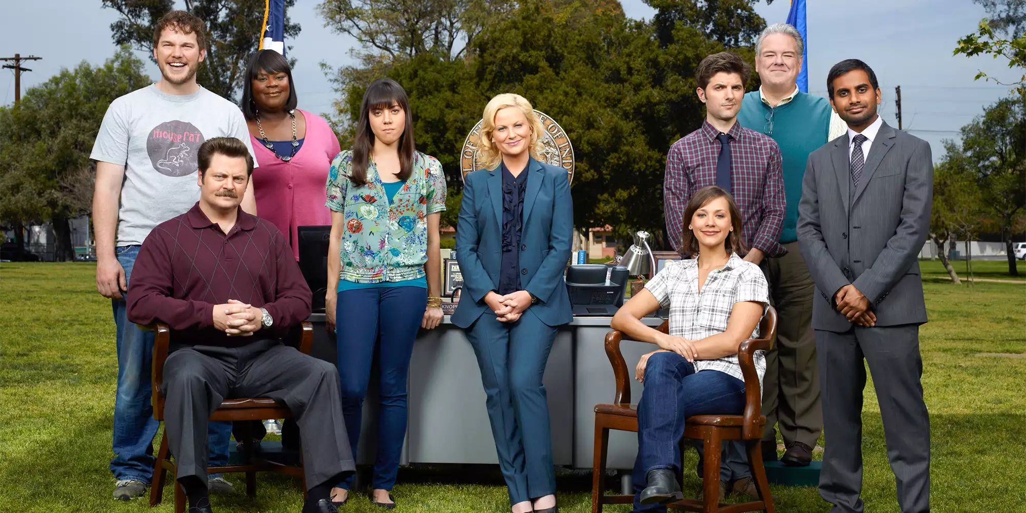The cast of NBC's 'Parks and Recreation' pose in the park.