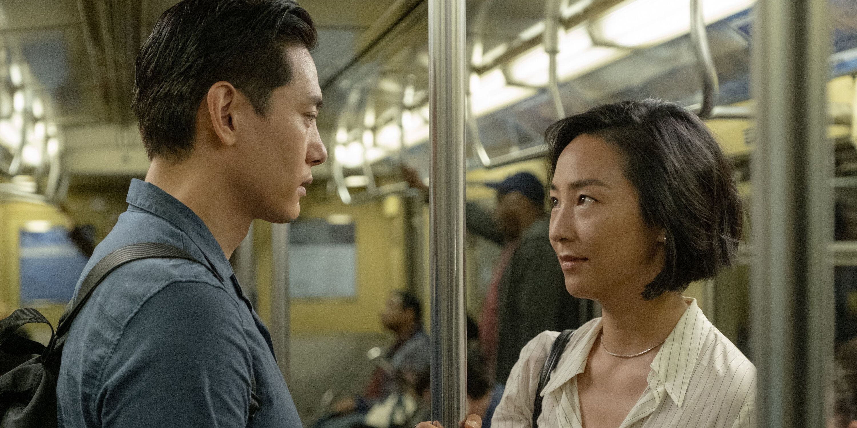Greta Lee and Tee Yoo on a train