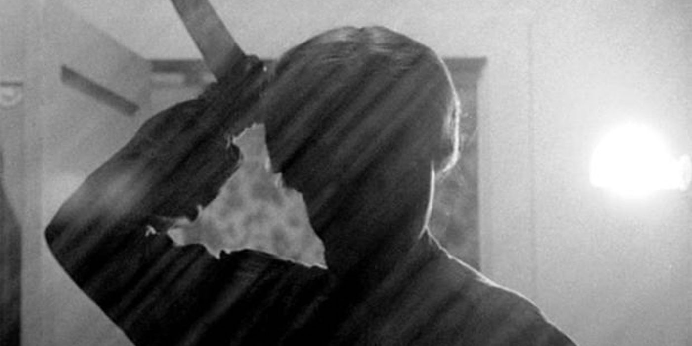 Norman Bates holding a knife in Psycho